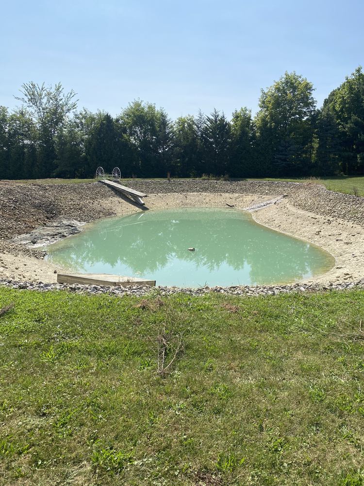 Pond restored and refilled after a leak repair by County Line Earthworx